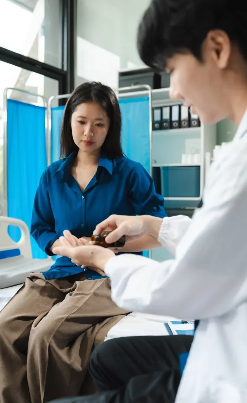 A doctor showing a tablet to a patient