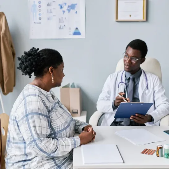Doctor consulting with a patient in clinic